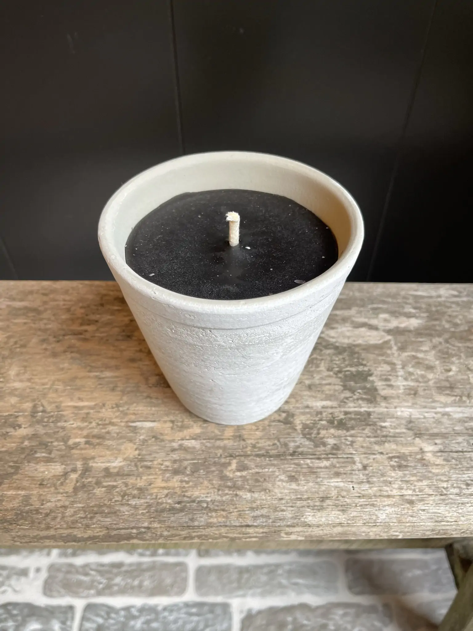 Grey age terracotta candle